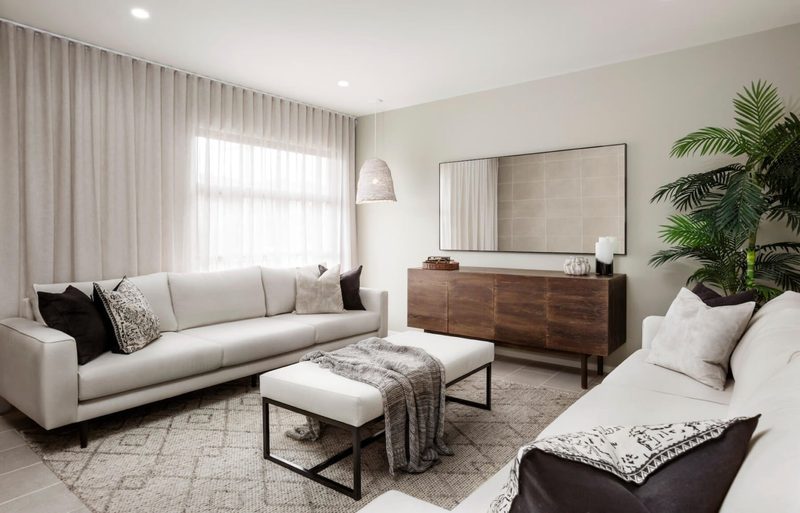 Floor-to-ceiling sheer S-fold curtains on a ceiling track in a modern Melbourne living room